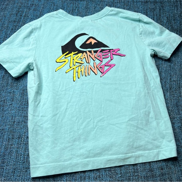 Quicksilver x Strangers Things Short Sleeve Graphic T-Shirt in Teal Blue Neon - Picture 1 of 6